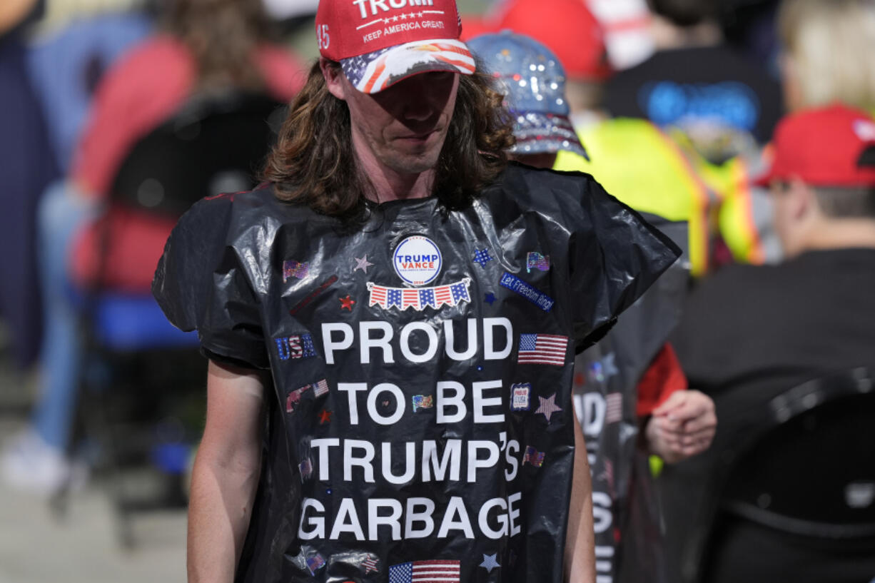 Supporters wearing garbage bags, arrive for a campaign rally for Republican presidential nominee former President Donald Trump, at First Horizon Coliseum, Saturday, Nov. 2, 2024, in Greensboro, NC.