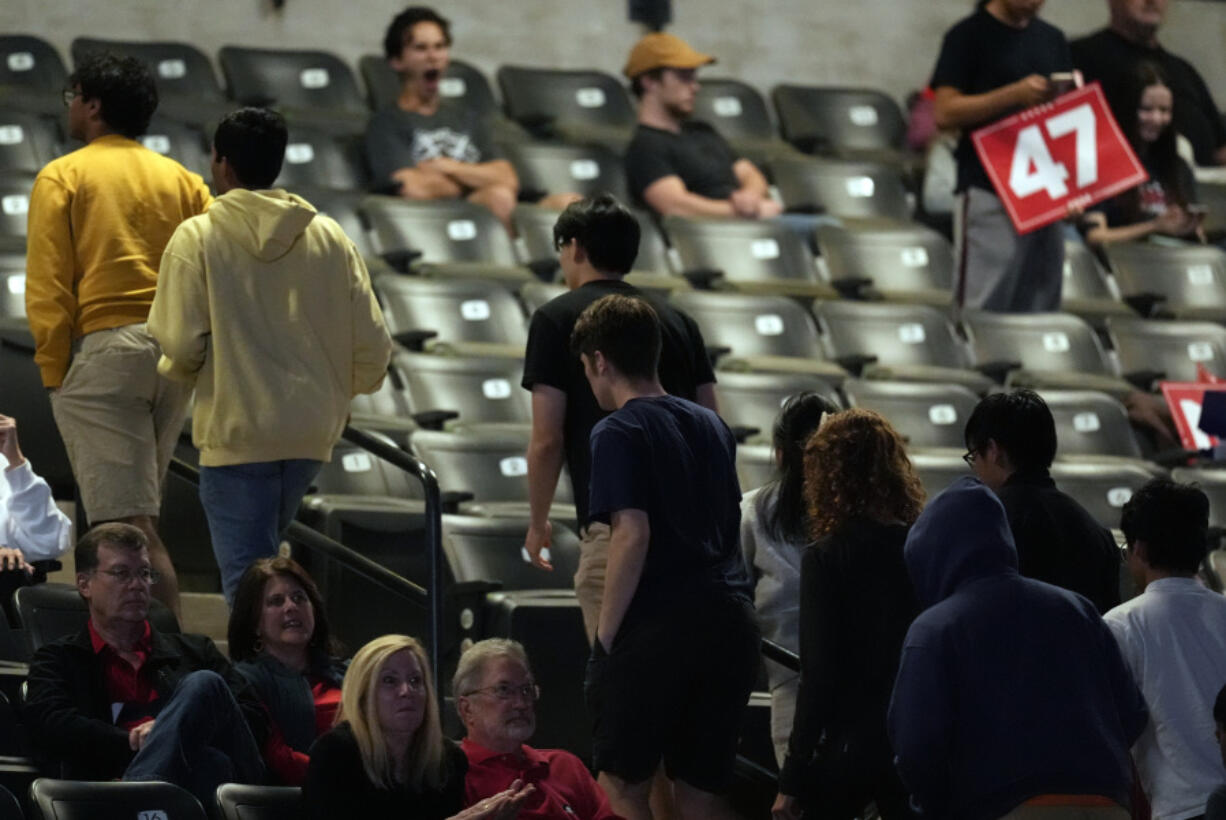 Supporters leave as Republican presidential nominee former President Donald Trump speaks at a campaign rally at McCamish Pavilion Monday, Oct. 28, 2024, in Atlanta.