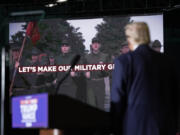 Republican presidential nominee former President Donald Trump watches as a video plays during a campaign rally at Greensboro Coliseum, Tuesday, Oct. 22, 2024, in Greensboro, N.C.