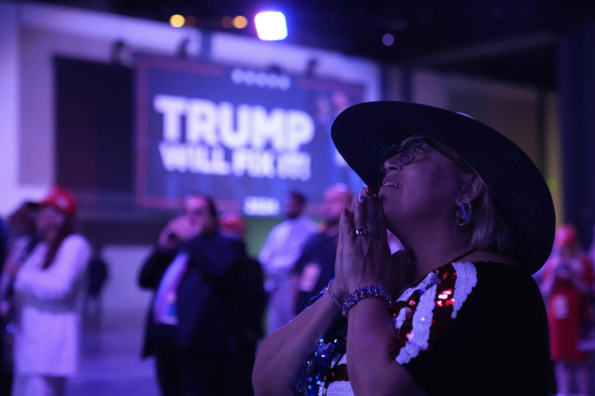 A supporter reacts as she watches election results at an election night campaign watch party for Republican presidential nominee former President Donald Trump Tuesday, Nov. 5, 2024, in West Palm Beach, Fla.