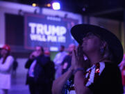 A supporter reacts as she watches election results at an election night campaign watch party for Republican presidential nominee former President Donald Trump Tuesday, Nov. 5, 2024, in West Palm Beach, Fla.