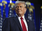 Republican presidential nominee former President Donald Trump arrives at an election night watch party at the Palm Beach Convention Center, Wednesday, Nov. 6, 2024, in West Palm Beach, Fla.