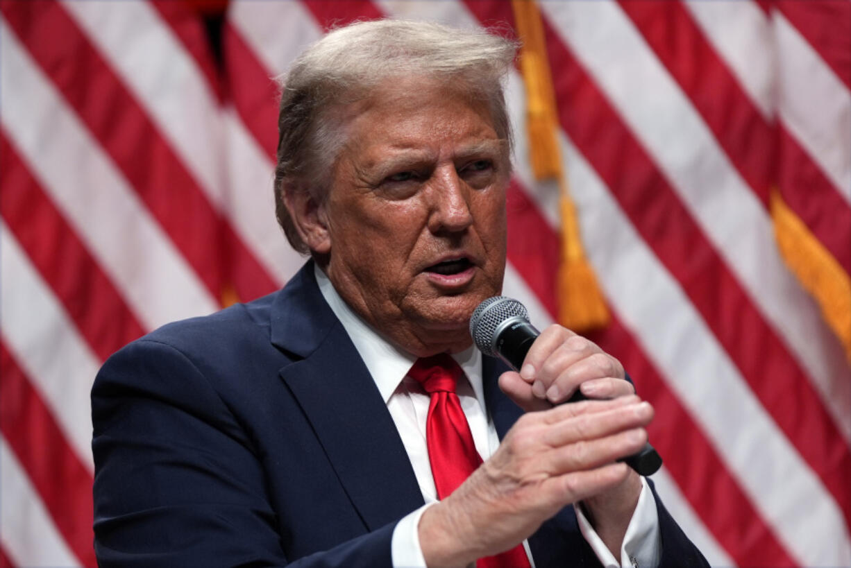 Republican presidential nominee former President Donald Trump speaks with Tucker Carlson during a Tucker Carlson Live Tour show at Desert Diamond Arena, Thursday, Oct. 31, 2024, in Glendale, Ariz.