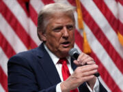 Republican presidential nominee former President Donald Trump speaks with Tucker Carlson during a Tucker Carlson Live Tour show at Desert Diamond Arena, Thursday, Oct. 31, 2024, in Glendale, Ariz.