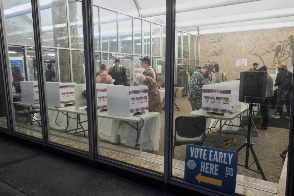 Voters cast their ballots at the Frank P. Zeidler Municipal Building during the first day of Wisconsin&rsquo;s in-person absentee voting Tuesday, Oct. 22, 2024, in Milwaukee.