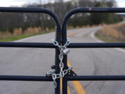 FILE - A locked gate on a closed road near the site of a planned Rivian electric truck plant is shown March 7, 2024, in Rutledge, Ga.