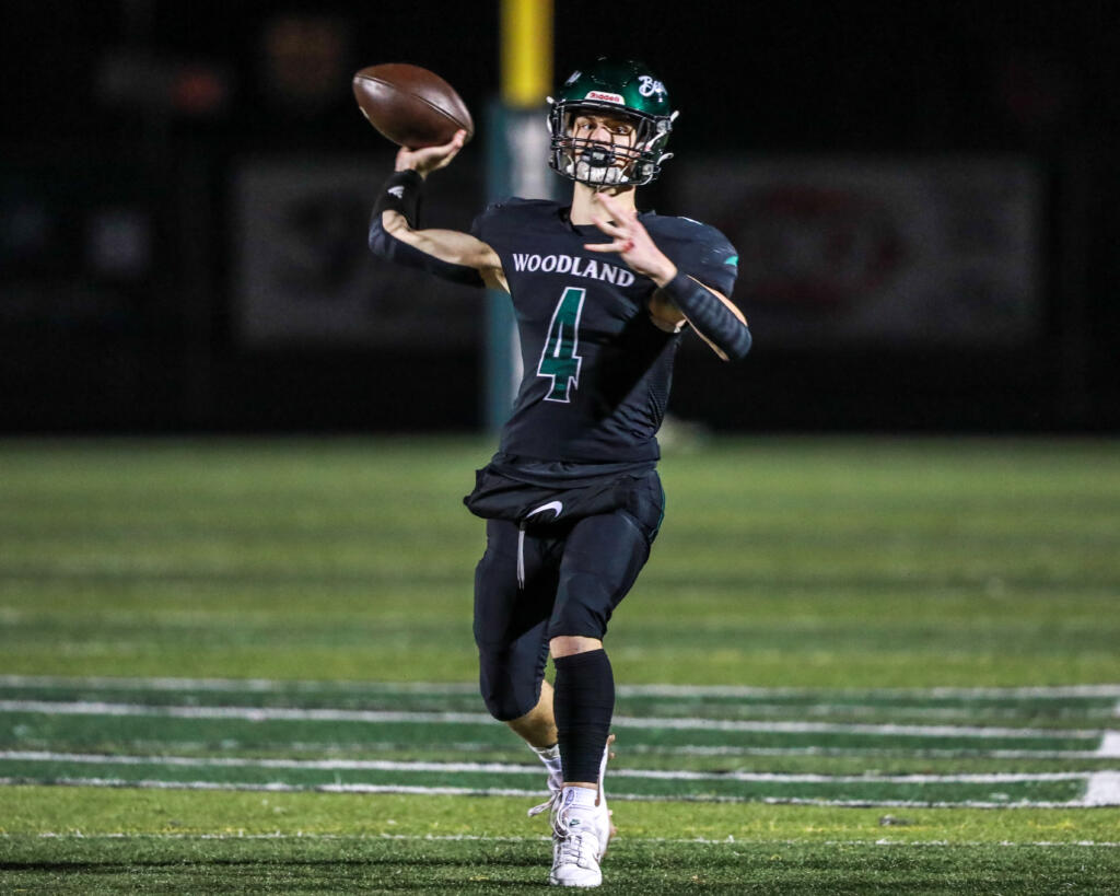 Elijah Andersen of Woodland attempts a pass during the Beavers' game against Cedarcrest in the 2A state preliminary round at Woodland High School on Friday, Nov.