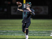 Elijah Andersen of Woodland attempts a pass during the Beavers' game against Cedarcrest in the 2A state preliminary round at Woodland High School on Friday, Nov.