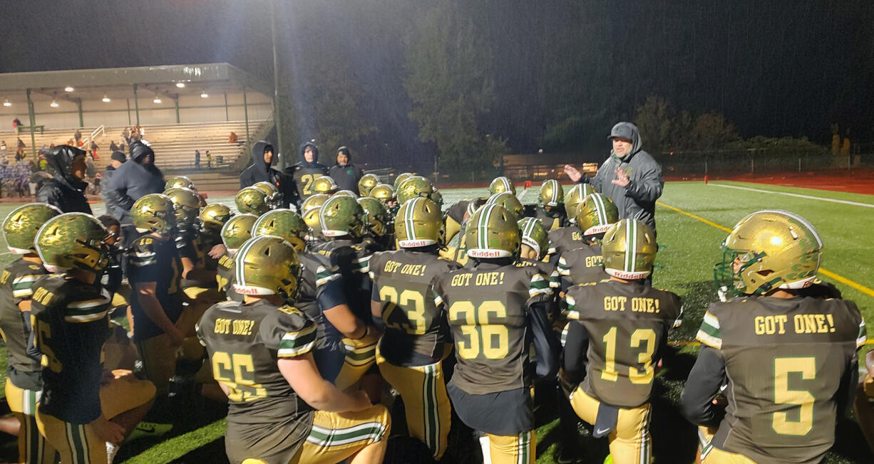 Evergreen football coach Christian Swain addresses his players after their 20-0 win over Mountain View on Friday, Nov. 1, 2024, at McKenzie Stadium.