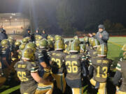 Evergreen football coach Christian Swain addresses his players after their 20-0 win over Mountain View on Friday, Nov. 1, 2024, at McKenzie Stadium.