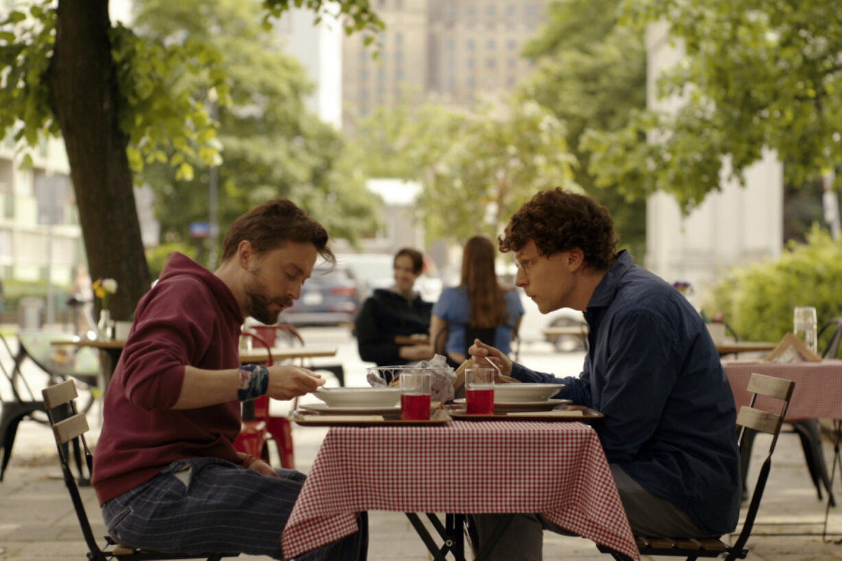 This image released by Searchlight Pictures shows Kieran Culkin, left, and Jesse Eisenberg in a scene from &ldquo;A Real Pain.&rdquo; (Searchlight Pictures via AP)