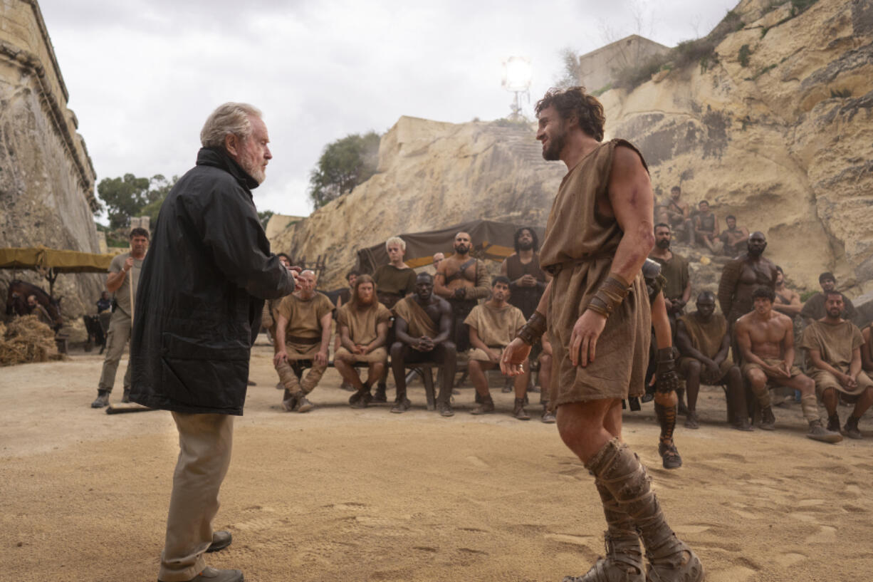 This image released by Paramount Pictures shows director Ridley Scott, left, and Paul Mescal on the set of &quot;Gladiator II.&quot;  (Aidan Monaghan/Paramount Pictures via AP)