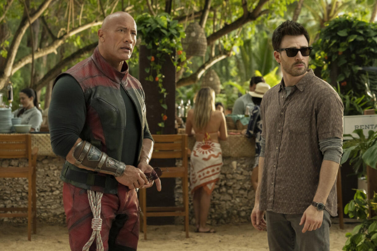 This image released by Prime shows Dwayne Johnson, left, and Chris Evans in a scene from &ldquo;Red One.&rdquo; (Frank Masi/Prime via AP)