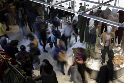 People shop at a retail store on Black Friday, Nov. 25, 2022, in New York.