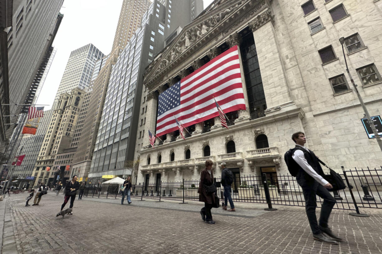 People pass the New York Stock Exchange in New York&rsquo;s Financial District on Tuesday, Nov. 5, 2024.