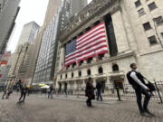 People pass the New York Stock Exchange in New York&rsquo;s Financial District on Tuesday, Nov. 5, 2024.