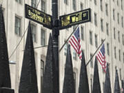 FILE - A sign marking the intersection of Broadway and Wall Street is shown in New York&rsquo;s Financial District on Oct. 30, 2024.