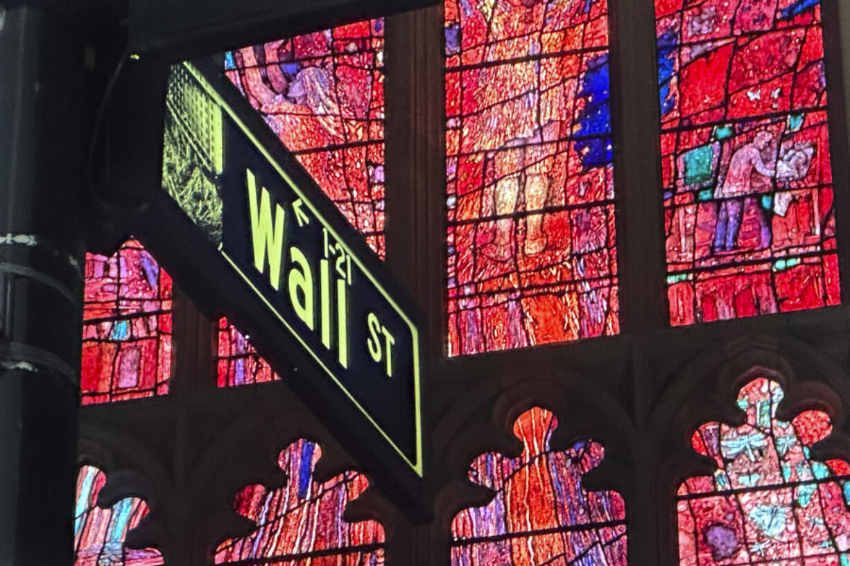 FILE - A sign marking Wall Street is shown near Trinity Church in New York&rsquo;s Financial District on Oct. 30, 2024.