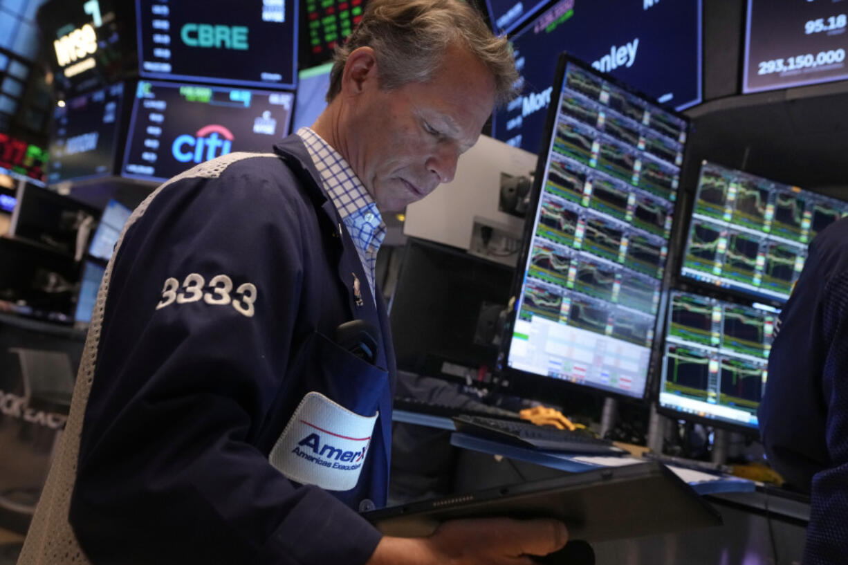 Trader Robert Charmak works on the floor of the New York Stock Exchange, Friday, Nov. 8, 2024.