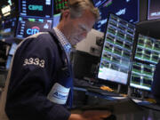 Trader Robert Charmak works on the floor of the New York Stock Exchange, Friday, Nov. 8, 2024.