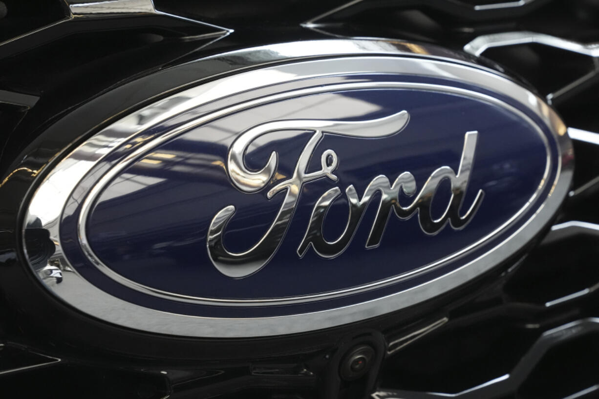 FILE - The Ford logo is seen on the grill of a Ford Explorer on display at the Pittsburgh International Auto Show in Pittsburgh, on Feb. 15, 2024. (AP Photo/Gene J.