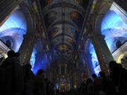 Video projections are seen Oct. 31 at the Saint-Sulpice church in Paris.