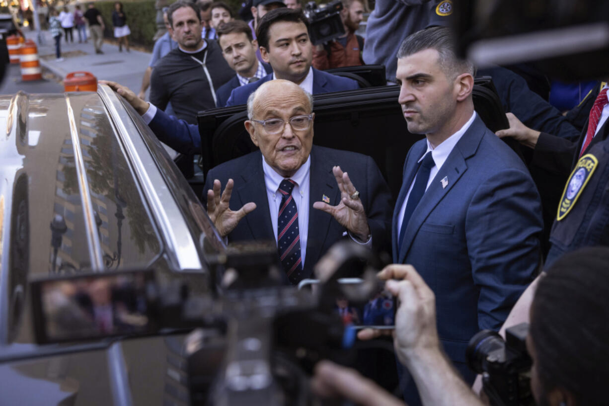 Former New York City Mayor Rudy Giuliani speaks to the members of the media as he leaves court in New York, Thursday, Nov. 7, 2024.