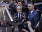 Former New York City Mayor Rudy Giuliani speaks to the members of the media as he leaves court in New York, Thursday, Nov. 7, 2024.