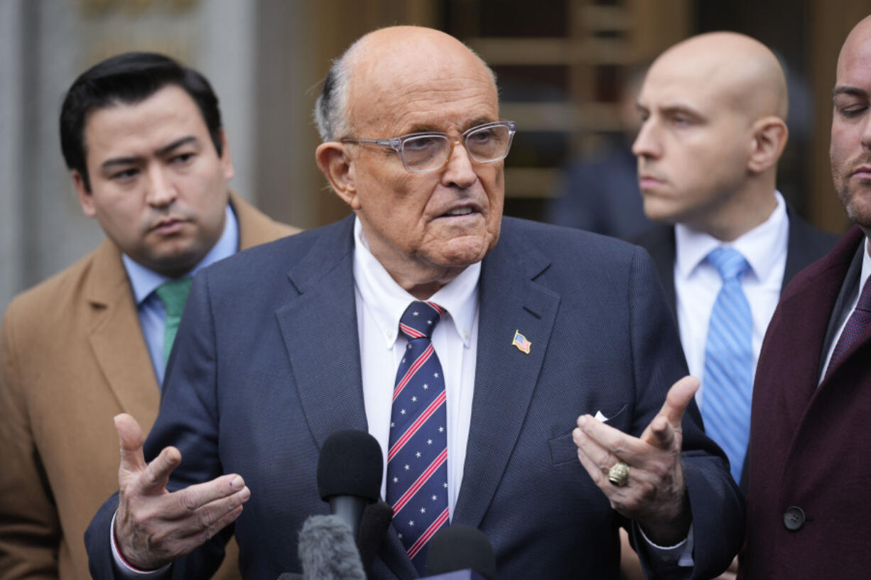 Rudy Giuliani speaks to reporters as he leaves the federal courthouse in New York, Tuesday, Nov. 26, 2024.