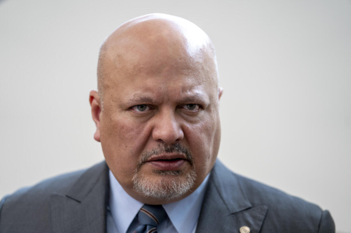 FILE - Karim Khan, Prosecutor of the International Criminal Court looks up prior to a press conference in The Hague, Netherlands, Monday, July 3, 2023.