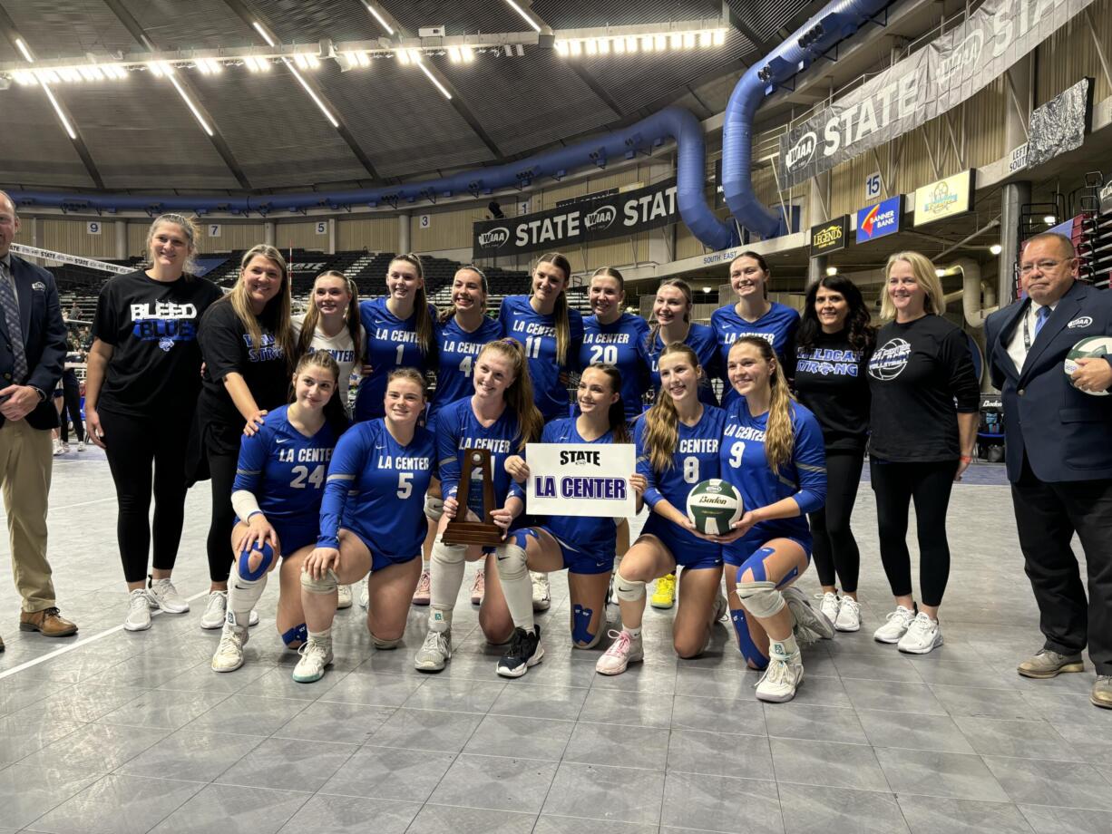 The La Center volleyball team poses after earning fourth place at the Class 1A state volleyball tournament on Saturday, Nov.