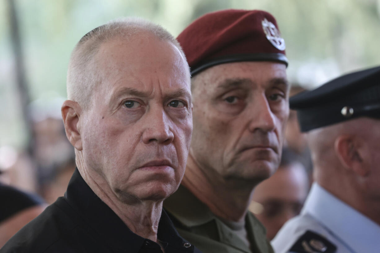 Israel&rsquo;s Defense Minister Yoav Gallant, left, and Chief of the General Staff Lieutenant-General Herzi Halevi, attend a ceremony marking the Hebrew calendar anniversary of the Hamas attack on October 7 last year that sparked the ongoing war in Gaza, at the Mount Herzl military cemetery in Jerusalem, Israel Sunday Oct. 27, 2024.