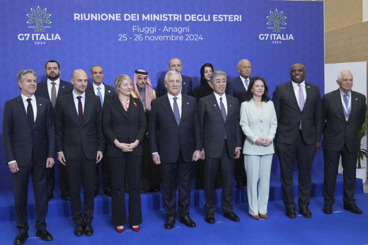 Front row from left, U.S. Secretary of State Antony Blinken , French Foreign Minister Jean-No&euml;l Barrot, Canada&#039;s Foreign Minister Melanie Joly, Italian Foreign Minister Antonio Tajani, Japanese Foreign Minister Takeshi Iwaya, German Foreign Minister Annalena Baerbock, Britain&#039;s Foreign Secretary David Lammy, and European Union foreign policy chief Josep Borrell pose for a family photo with, second row from left, foreign Ministers of Quatar, Mohammed Abdulaziz Al-Khulaifi, Egypt, Badr Ahmed Mohamed Abdelatty, Saudi Arabia, Faisal Farhan Al Saud, Jordan, Ayman Safadi, United Arab Emirates, Reem Ebrahim Al Hashimy, and Secretary-General of the Arab League, Ahmed Aboul-Gheit at the G7 of foreign Ministers in Fiuggi, some 70 kilometers south-east of Rome, Monday, Nov. 25, 2024.