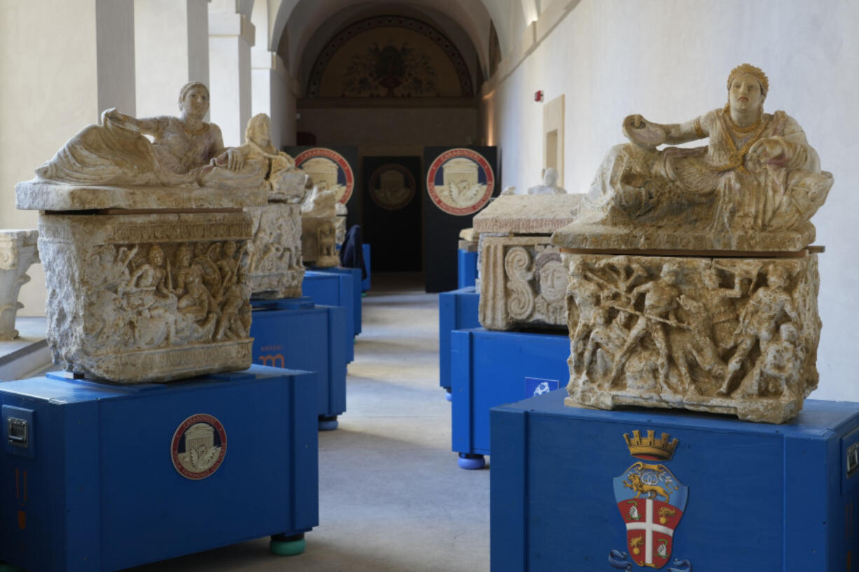 Archaeological finds from the Etruscan era and recovered in a police operation are shown Tuesday during a press conference in Rome.