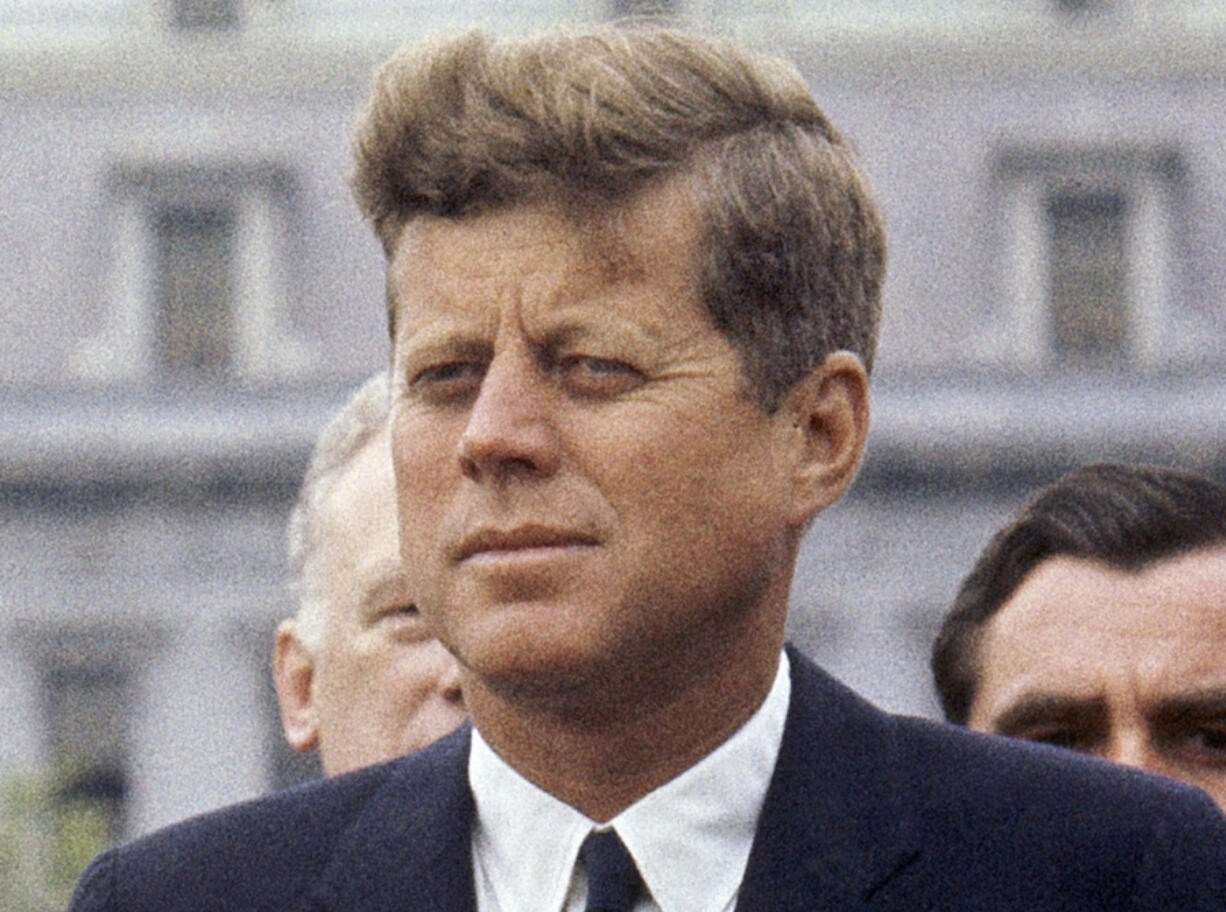 FILE - President John F. Kennedy listens while Grand Duchess Charlotte of Luxembourg speaks outside the White House, April 30, 1963, in Washington. (AP Photo/William J.