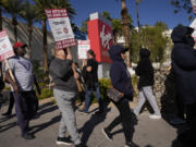 Members of the Culinary Workers Union picket in front of the Virgin Hotels Las Vegas, Friday, Nov. 15, 2024, in Las Vegas.