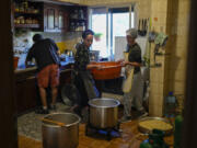 Volunteers prepare meals at a women&rsquo;s art center that was turned into a kitchen for displaced people who fled southern Lebanon amid the ongoing Hezbollah-Israel war, in the town of Aqaibe, northern Lebanon, Thursday, Oct. 24, 2024.