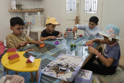 Palestinian children who were brought to Lebanon from the Gaza Strip for treatment, play at a summer camp in Beirut, Lebanon, Friday, Aug. 30, 2024.