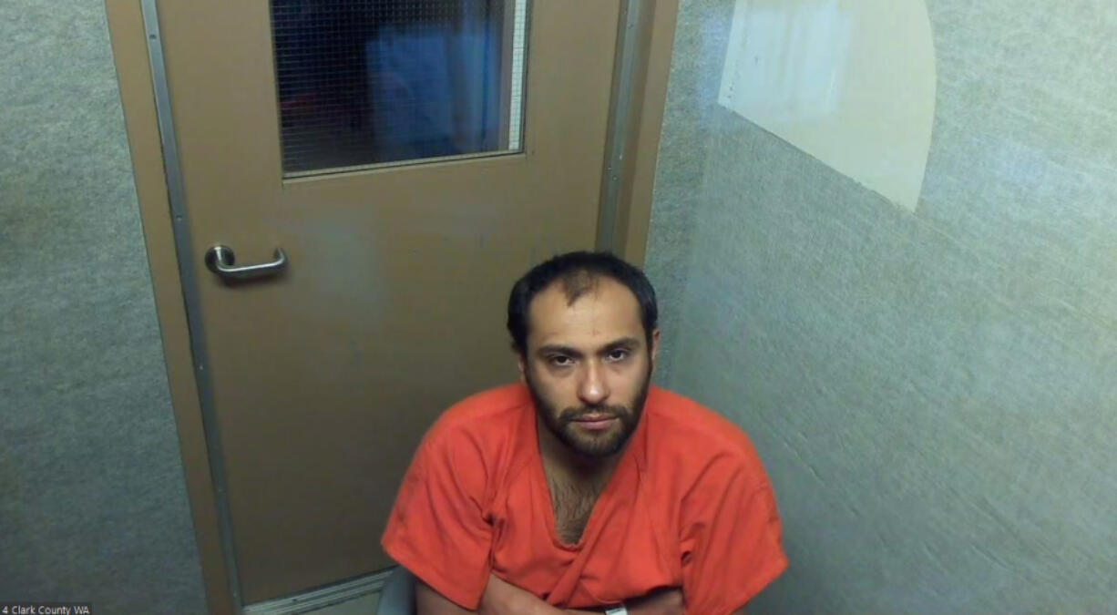 Salvador Aguilar, 31, appears in May in Clark County Superior Court in connection with a stabbing at Clark College. He was sentenced Friday to 10 years in prison for stabbing a Clark College employee in the neck.