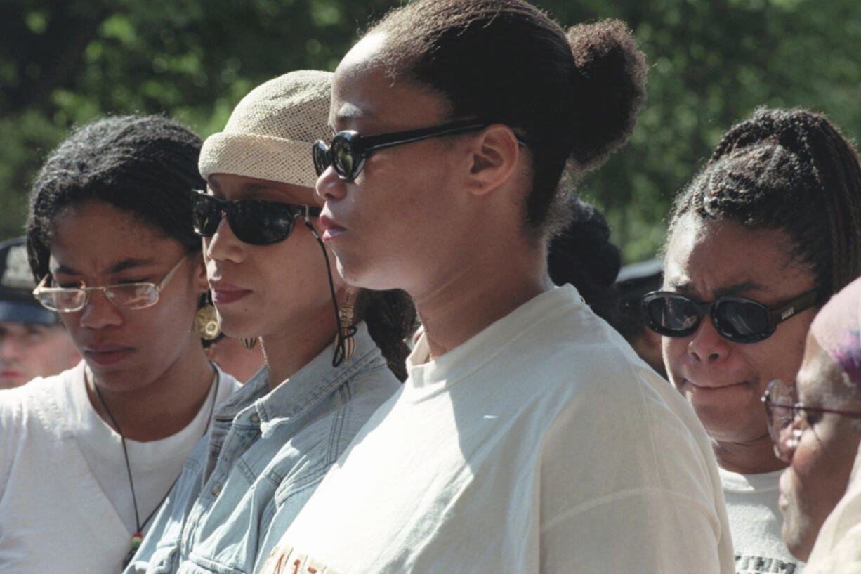 FILE - Malcolm X&#039;s daughters Malikah Shabazz, left, Attallah Shabazz, second from left, Malaak Shabazz, third from left, and Gamilah Shabazz, talk to the media outside the Jacobi Medical Center in the Bronx borough of New York, following the death of their mother, Betty Shabazz, June 23, 1997.