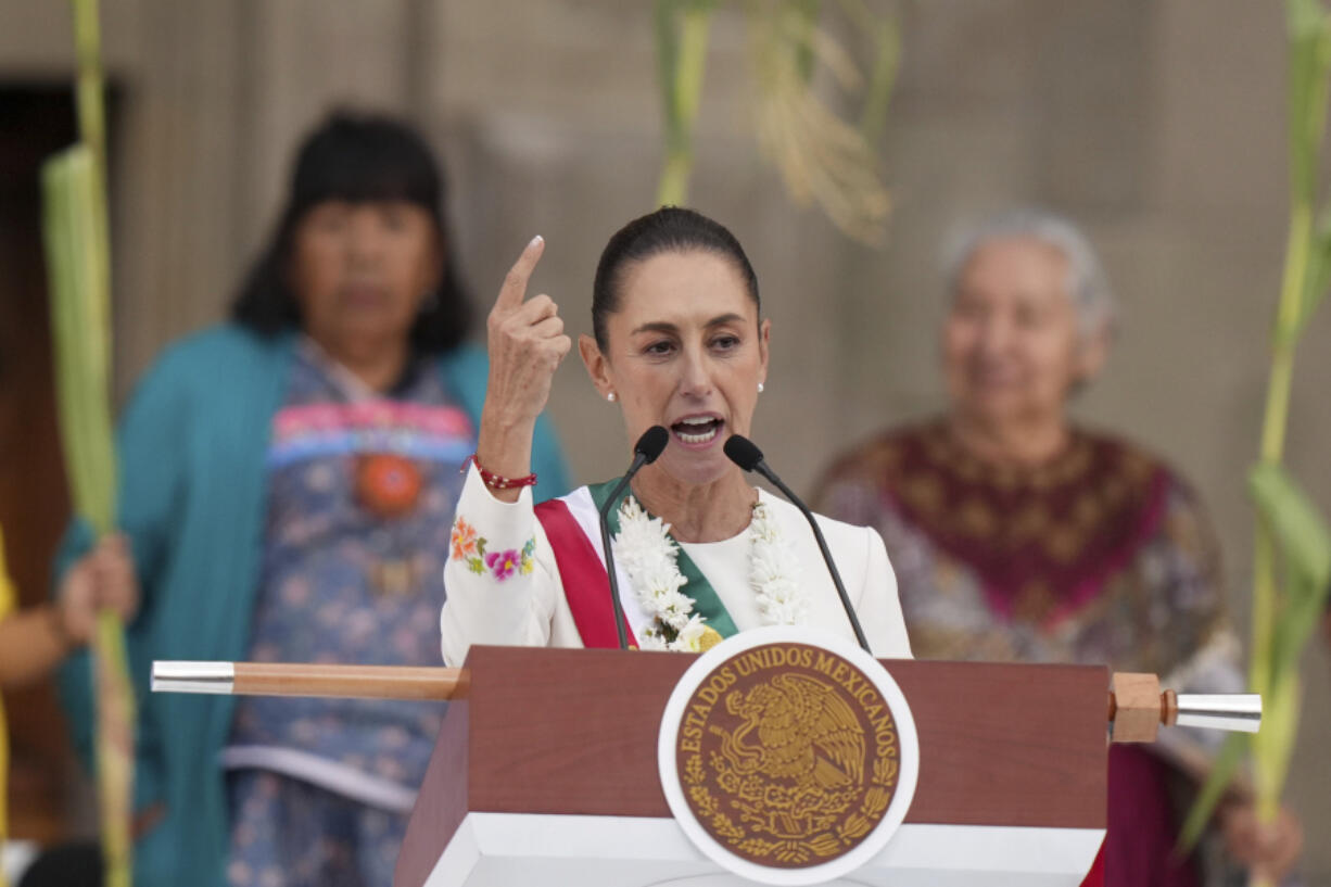 FILE - Newly-sworn in President Claudia Sheinbaum addresses supporters in the Z&oacute;calo, Mexico City&rsquo;s main square, on Oct. 1, 2024.