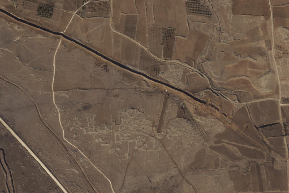 This satellite image from Planet Labs PBC shows Israeli forces digging along the Alpha Line separating the Israeli-occupied Golan Heights from a demilitarized zone in Syria patrolled by United Nations forces on Nov. 5, 2024.