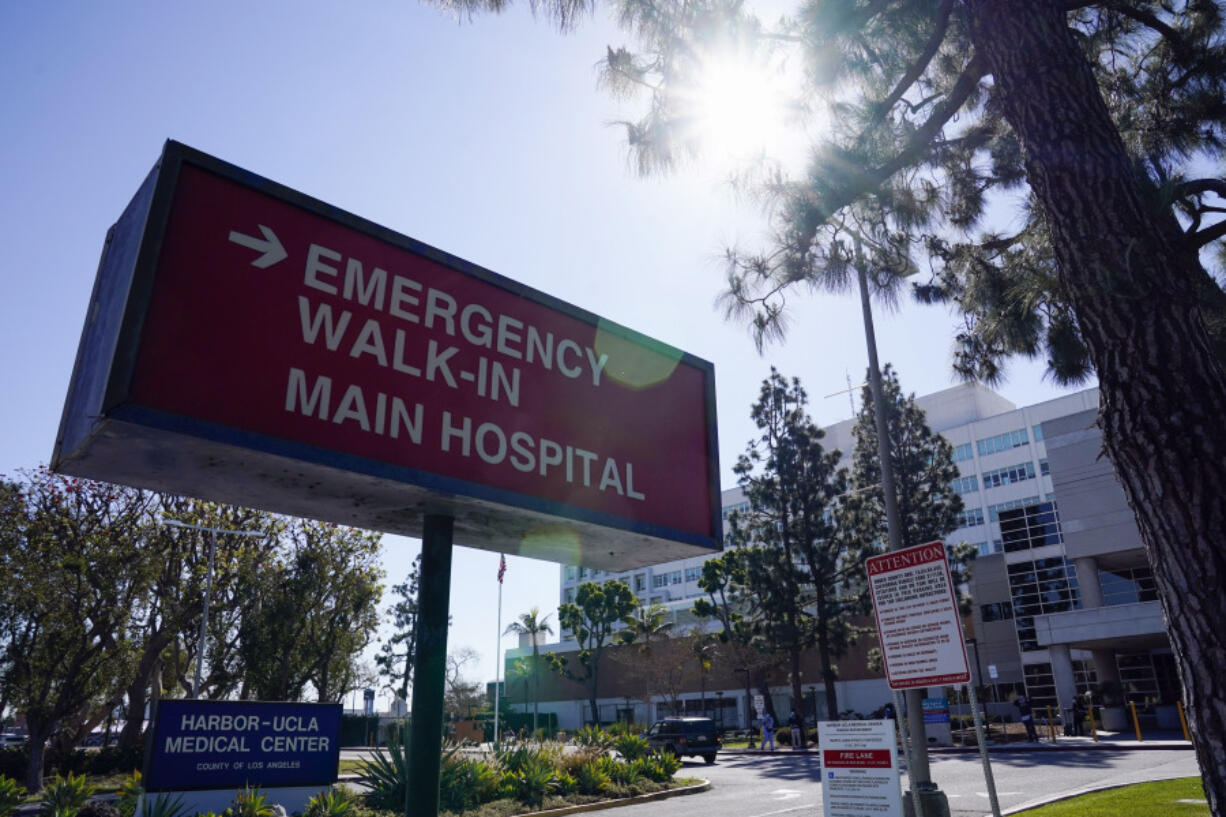 FILE - An emergency room sign is displayed outside Harbor-UCLA Medical Center, Feb. 24, 2021, in Torrance, Calif.