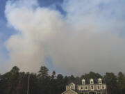 Smoke from a forest fire rises above the trees in Evesham,N.J. on Thursday, Nov. 7, 2024, when firefighters said conditions were the driest in New Jersey in nearly 120 years.