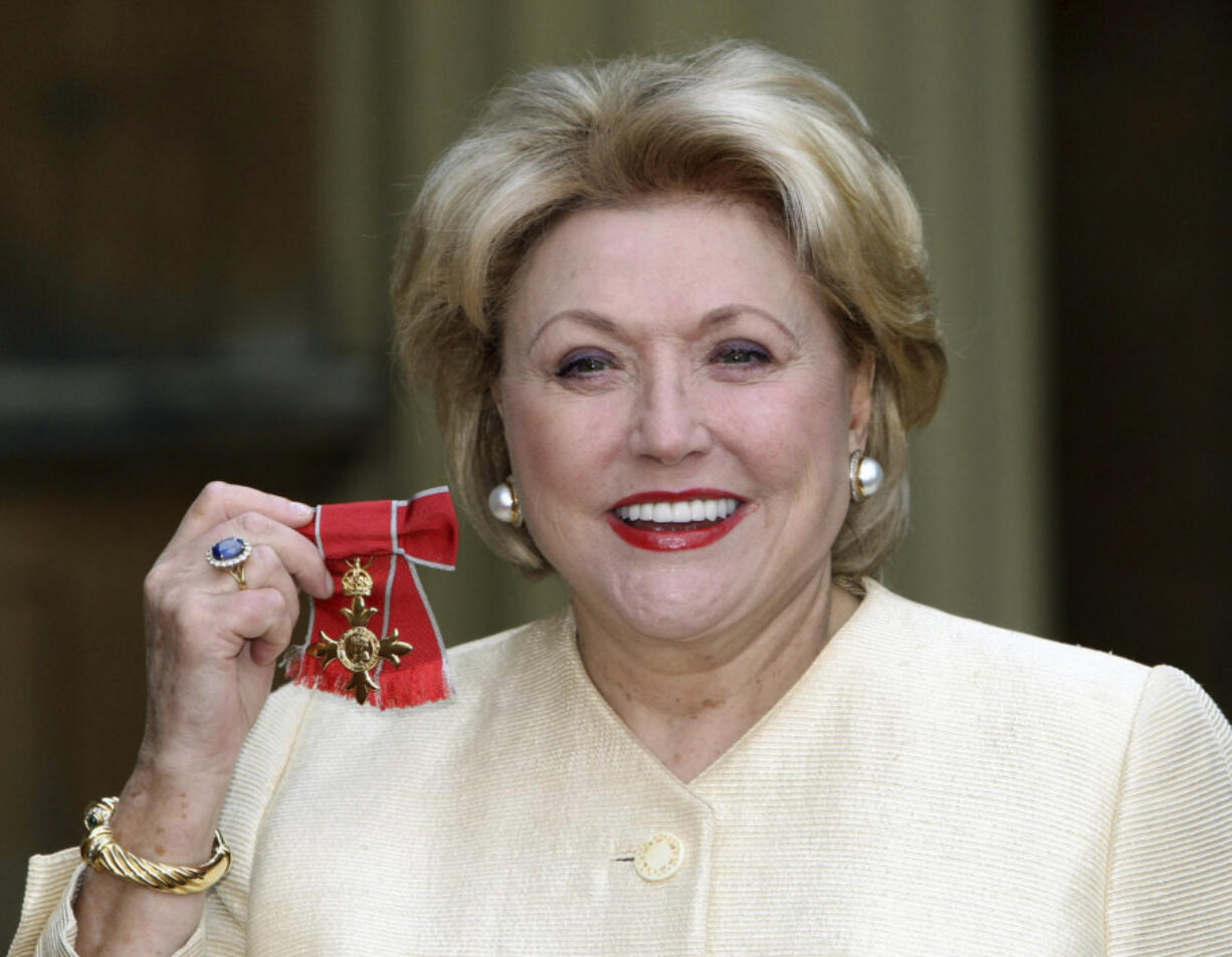 FILE - Author Barbara Taylor Bradford after she received her Most Excellent Order of the British Empire from Britain&#039;s Queen Elizabeth II at Buckingham Palace, London, Wednesday, Oct. 10, 2007.