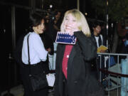 Actress Teri Garr shows off her ticket at the premiere of &ldquo;Michael,&rdquo; Dec. 19, 1996 in Beverly Hills, Calif. (Mark J.