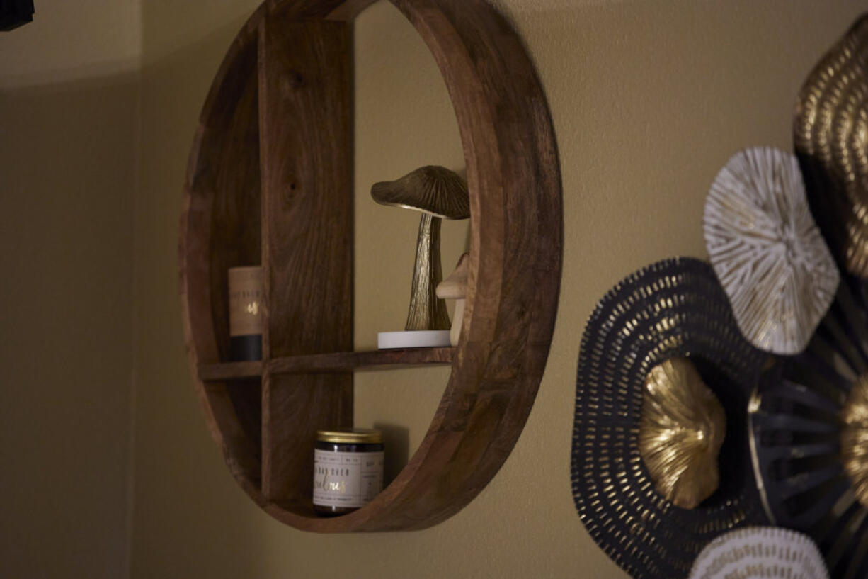 Mushroom decorations hang on the wall in a room for a patient journey at a Psilocybin facility in Gresham, Ore., Monday, Nov. 18, 2024.