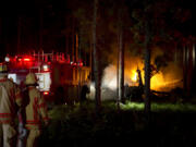 Local emergency responders extinguish the fires caused by a CV-22 Osprey crash that occurred at Eglin range June 13, 2012 near Eglin Air Force Base, Fla. (Airman 1st Class Christopher Williams, U.S.