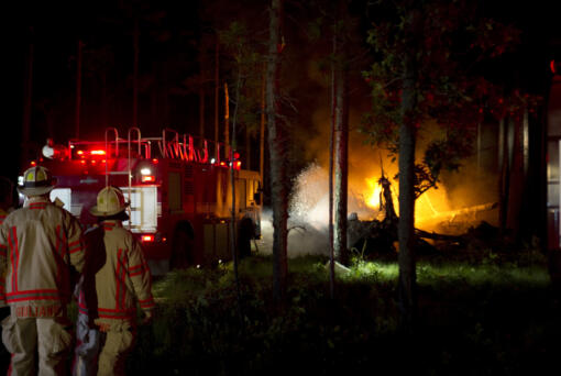 Local emergency responders extinguish the fires caused by a CV-22 Osprey crash that occurred at Eglin range June 13, 2012 near Eglin Air Force Base, Fla. (Airman 1st Class Christopher Williams, U.S.