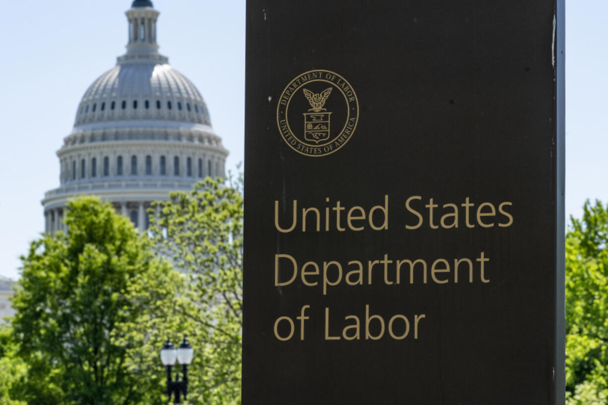 FILE - The entrance to the Labor Department is seen near the Capitol in Washington, Thursday, May 7, 2020. (AP Photo/J.